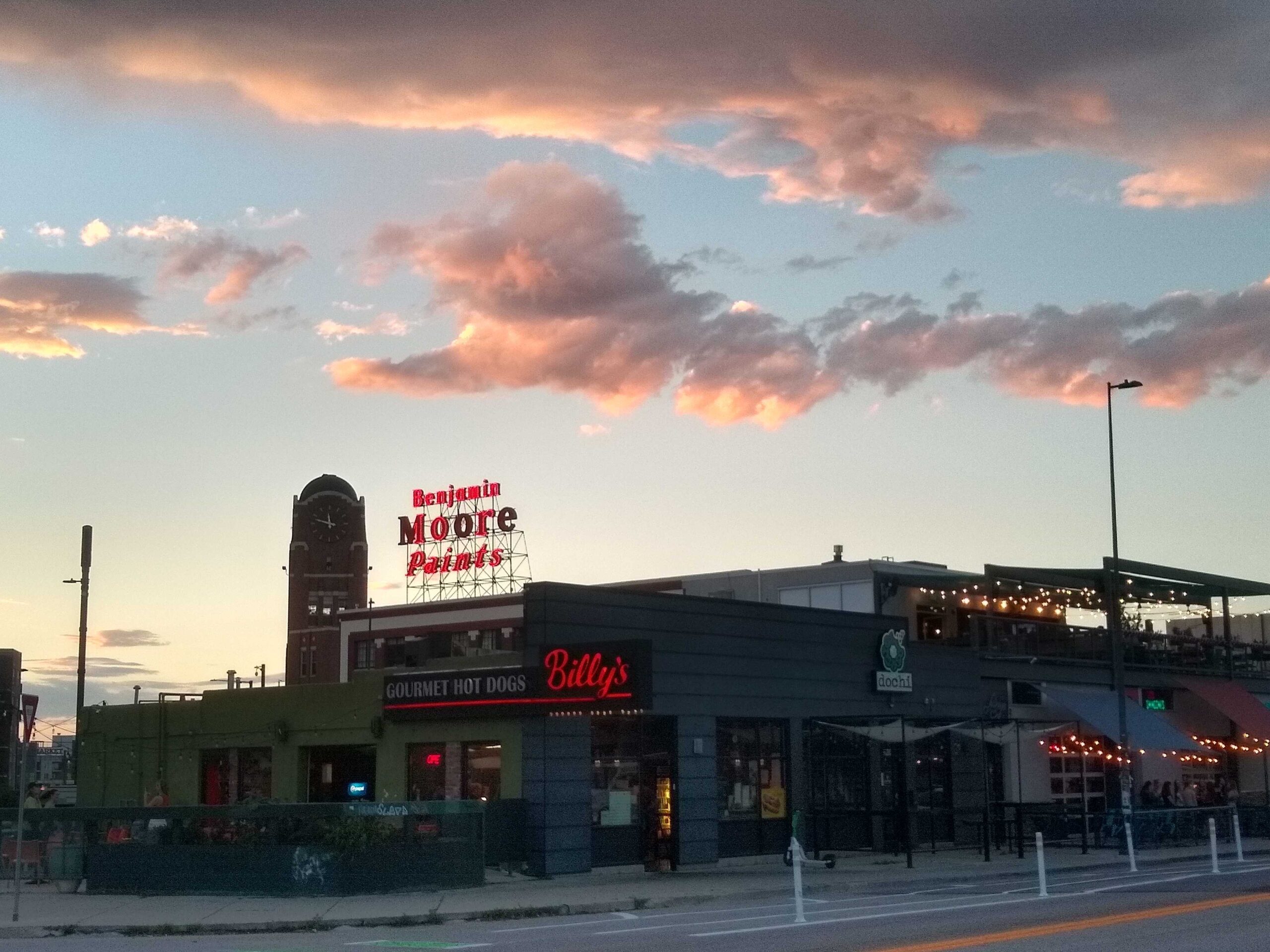 neon Benjamin Moores Paints sign in Denver at sunset
